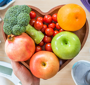 Fresh fruit in a heart-shaped bowl