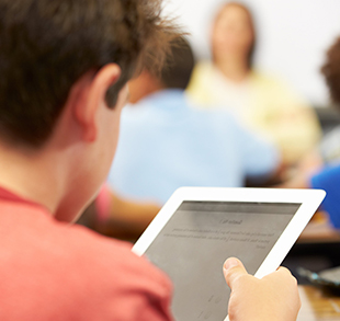 Student using his tablet computer