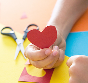 Red heart cut out of paper